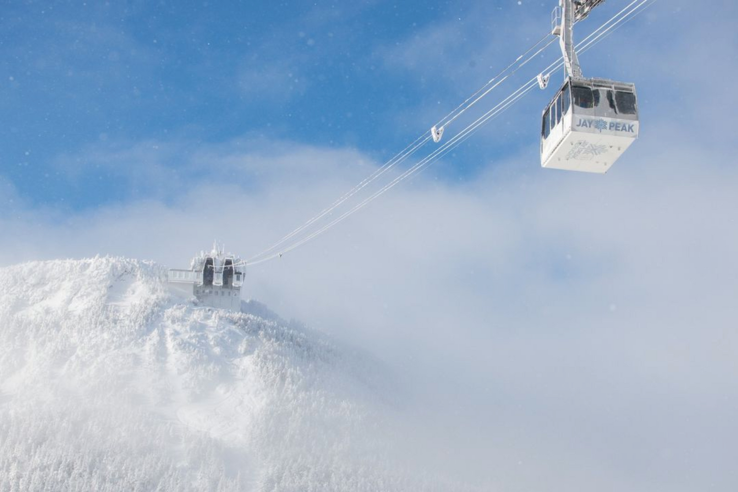 Jay Peak Vermont ski lift and snowy mountain